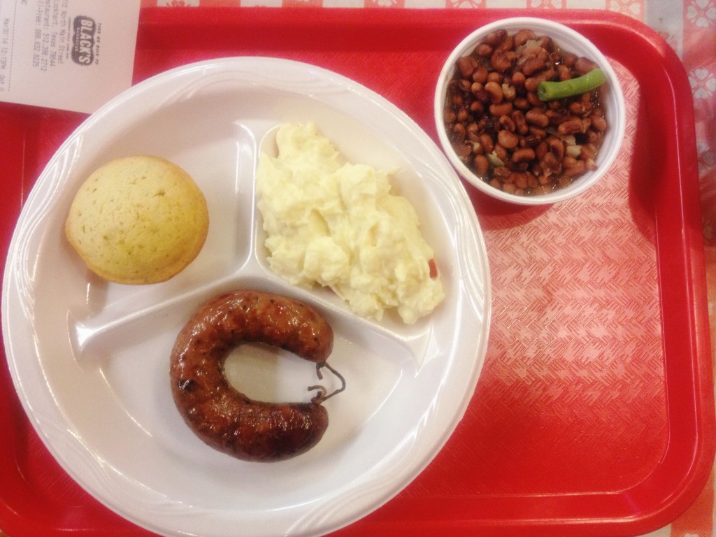 Smoked sausage, divine field peas and jalapeño cornbread at Black's